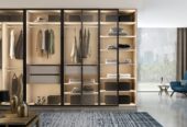 Glass-framed-sliding-door-wardrobe-with-dark-aluminium-frame-and-clear-glass-front