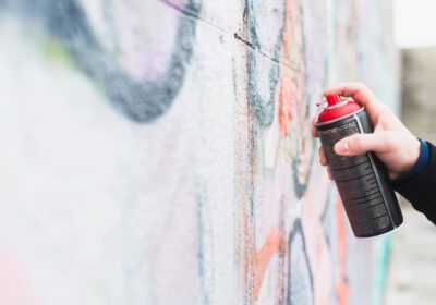 artist-painting-graffiti-with-spray-can